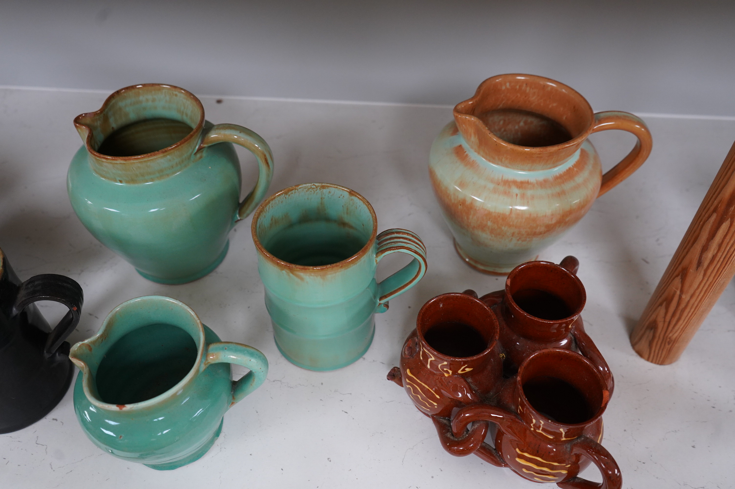 Ten items of Dickerware pottery, including a Uriah Clark and Nephew trio of connected jugs, tallest 21cm